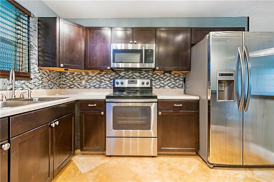 Beautiful 2/2 in a great quiet community. Available for Immediate Application! Updated kitchen, Stainless Steel Appliances and tile through-out! Updated bathrooms and walk-in closet will make any tenant happy! Private enclosed patio area as well