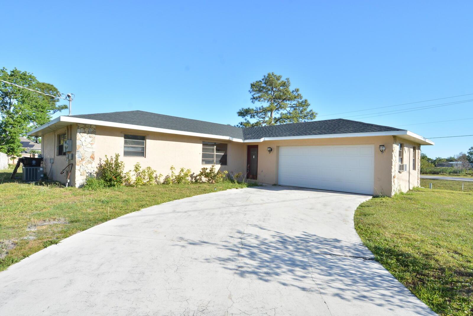 Step inside this spacious 3/2/2 CBS home with NEW 2025 ROOF situated on an oversized corner lot! Offers a newer kitchen, large living room, ceramic tile throughout, covered/screened-in patio. 2-car garage is complete with washer, dryer, and ample storage space. Located in the heart of Port St. Lucie with NO HOA! Convenient to shopping, restaurants, schools, beaches, and highways. Currently there is road construction, but should be done soon. Schedule your showing today!