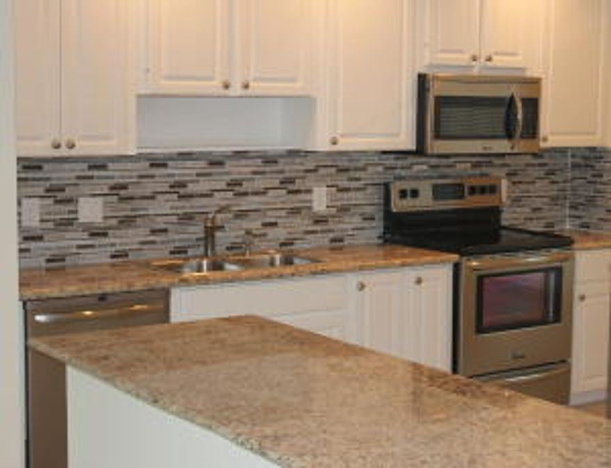 Golfer's Dream! Move into your new home! Italian marble throughout, granite countertops/glass backsplash/stainless steel appliances in kitchen two level townhome. Designated laundry room. Covered balcony/patios off of both floors with expansive golf-course views. 24-hour guarded gate. Mandatory Golf Maintenance Fee - Additional $615.00 per quarterNo pets, trucks, or motorcycles at Riverbend Country Club.