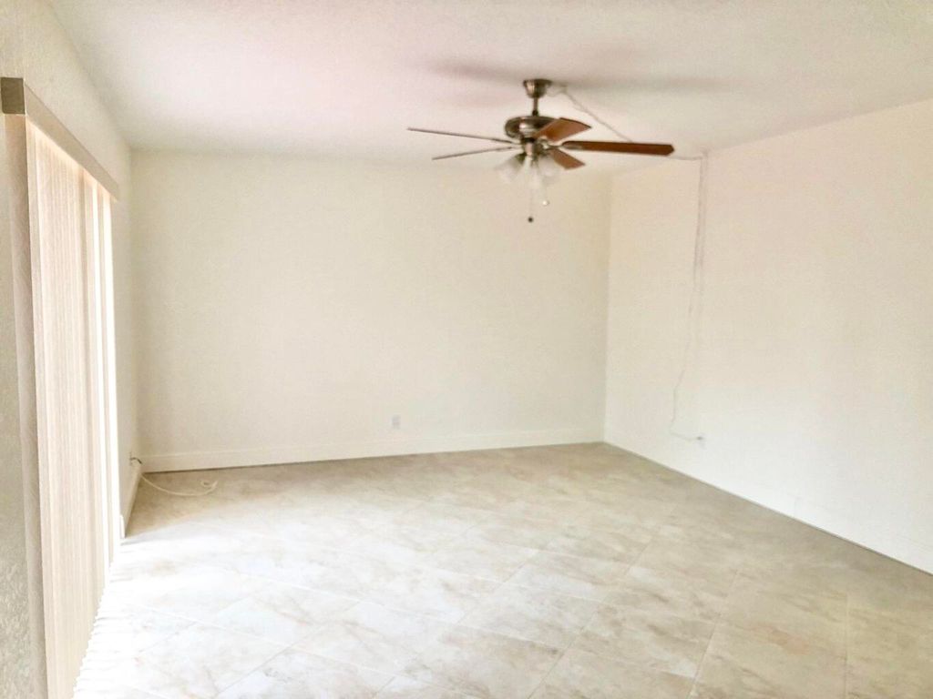Photo of 313 Lake Arbor Drive, Palm Springs, FL 33461 (MLS # R10950053)