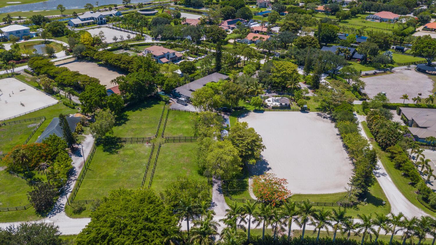 Winter Heaven Farm is opening the gates once again for the 2025/2026 WEF season for you to enjoy this fabulous 13 stall barn in the highly sought-after Saddle Trail Park of Wellington. In addition to being hacking distance to the WEF show grounds, features of this farm include a business friendly tack room with a kitchenette and grooms quarters, laundry room/half bath, feed room, a covered horse gym treadmill, 3 wash bays, plentiful grooming areas, and four large grass paddocks. Tractor, drag, and full set of jumps are also included to properly maintain the 125'x200' irrigated arena. Do not miss out on this unique opportunity!!