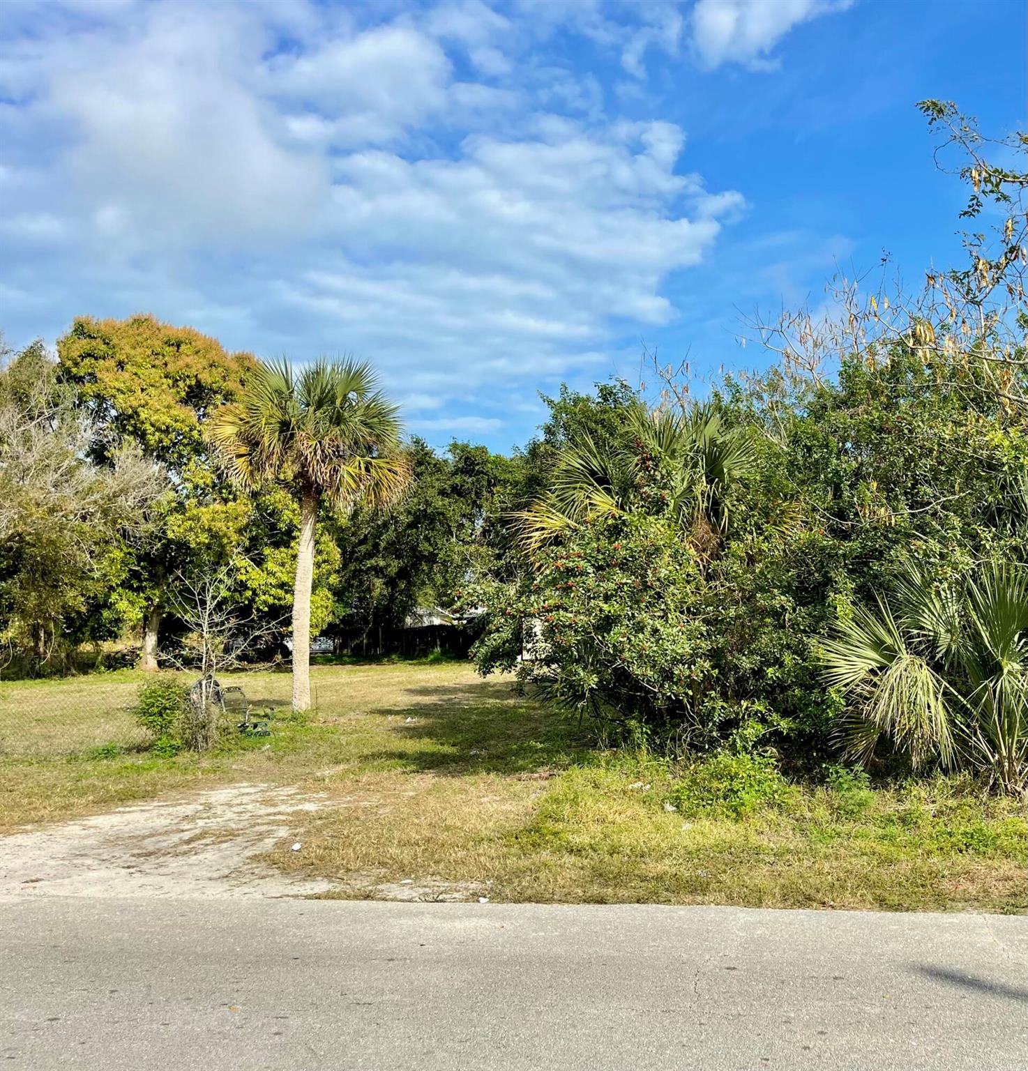 Attention Investors, Builders, and Future Home Owners! This Multi-Family Zoned Lot offers unique potential, must sell with adjacent lot MLS##RX-11058391. Price is per lot. Perfect for expanding your portfolio. Situated on a paved road and partially cleared, this RM-10 zoned property allows for a duplex, single-family home, or a long-term investment hold. Conveniently located just a short drive from shopping, dining, medical facilities, and beautiful local beaches. Don't miss out on this great opportunity.