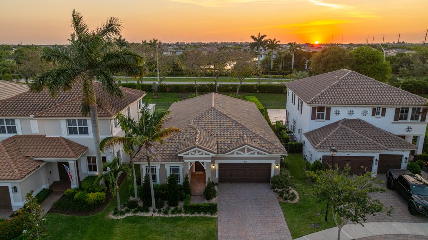 Is an incredible outdoor living space at the top of your list? This stunning Mira Lago home delivers with a brand-new resort-style pool and patio that truly steals the show. Designed for entertaining, the backyard features marble pavers, a covered lounge area, summer kitchen, and a custom pool with spillover spa and fire feature wrapped in Myra white stacked stone. Inside, the home is pristine with engineered wood floors, crown and decorative molding, and fresh paint inside and out. The bright, open kitchen offers white cabinetry, granite countertops, glass tile backsplash, under-cabinet lighting, and a gas cooktop. Impact windows and doors throughout. Split bedroom plan with a secondary en-suite. Quiet cul-de-sac location with access to Mira Lago and Cascata amenities!