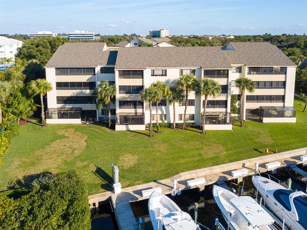 Spectacular DIRECT intracoastal water views from this stunning 2 bedroom and 2 bathroom waterfront condo. This condo is the top floor of the building so this unit truly boasts soaring cathedral ceilings. The condo has been beautifully updated with special attention to detail right down to the plantation shutters. The kitchen is wide open to the living/family room and dining area and you can see the water views from from every area in the lining space. The enclosed patio adds to the living space so just sit back, watch the boats go by and enjoy the views . A brand new Rheem AC unit was just installed with a UV light killing all mold and viruses in the unit. Oak Harbour is centrally located in Juno Beach and has a 24/7 manned gate. There are 2 pools, tennis, marina and a Clubhouse .