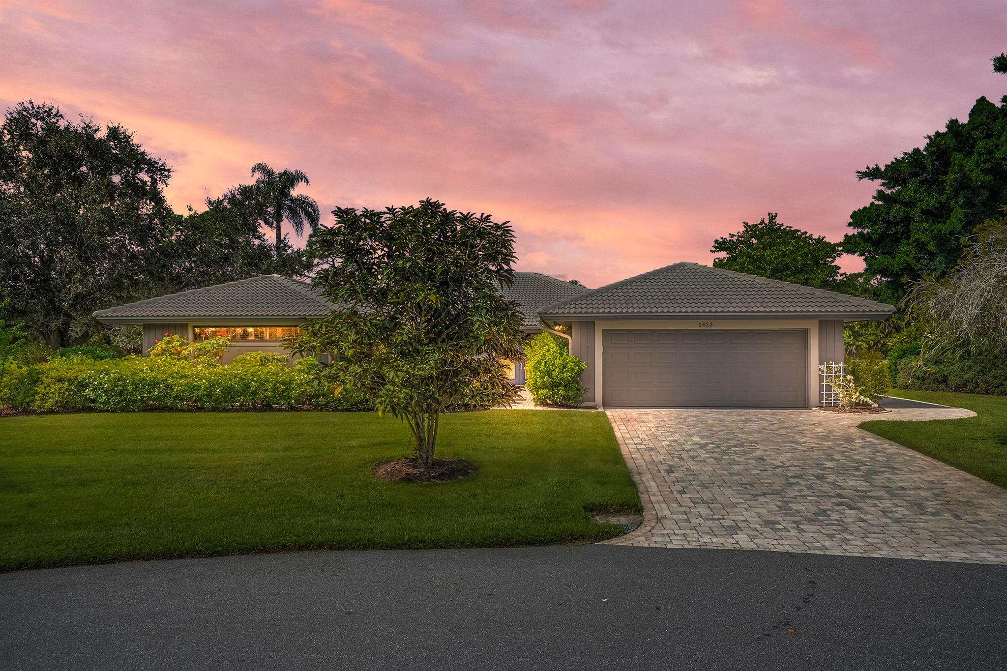 Tucked away on a private cul-de-sac, this beautiful home sits on an oversized lot and comes with impact windows for peace of mind. From every window, you can enjoy panoramic views of the golf course and the sparkling pond, creating a setting that truly feels like a retreat.Inside, soaring cathedral ceilings enhance the spacious living and dining rooms, while the bright eat-in kitchen is filled with natural light and offers plenty of space for casual dining. The home features tile flooring throughout, plantation shutters on the windows, and a screened lanai with a beautiful awning, offering the perfect spot to relax outdoors.The air-conditioned garage, provides extra comfort and includes dedicated space for a golf cart, making it ideal for the Florida lifestyle !