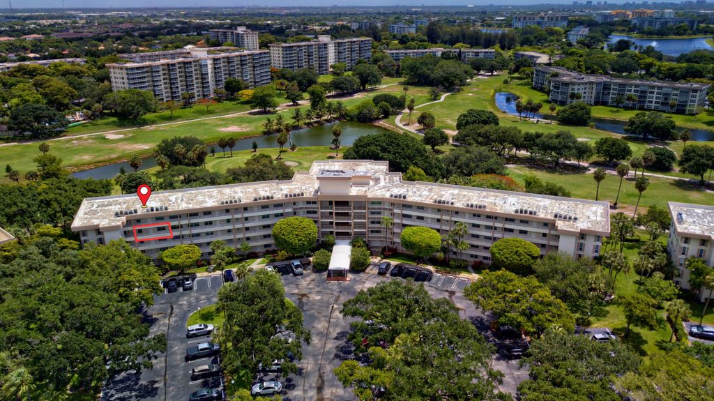 Photo of 3900 Oaks Clubhouse Drive #411, Pompano Beach, FL 33069 (MLS # B26034581)