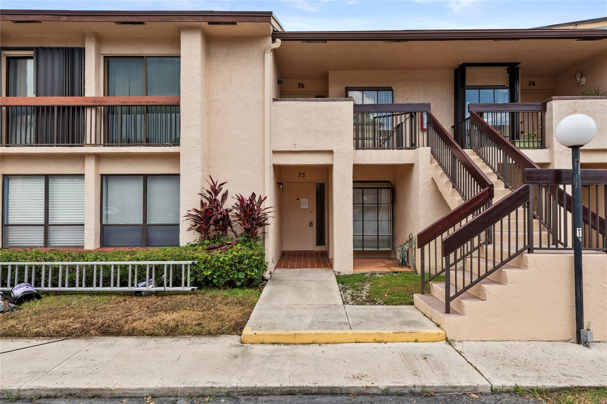 Welcome to this lovely first-floor condo featuring 2 spacious bedrooms and 2 full bathrooms. The updated kitchen boasts sleek stainless steel appliances, perfect for modern living. Enjoy the convenience of an in-unit washer and dryer, along with easy-to-maintain tile flooring throughout—no carpet! Relax on the peaceful, screened-in porch overlooking a serene garden view. The generously sized bedrooms include a walk-in closet for ample storage. Ideally located just minutes from Deerfield Beach, shopping centers, and a variety of restaurants—this condo combines comfort, style, and convenience. Amenities include heated pool and jacuzzi, fitness center, library and clubhouse. All ages are welcome, no renting during the first year of ownership per association. 25% down necessary if financing.