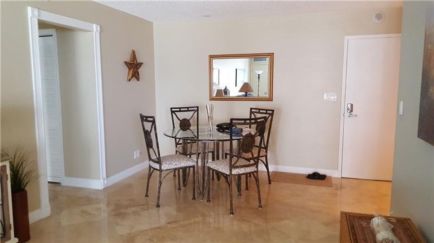 Experience refined coastal living in Highland Beach. This beautifully renovated 2-bedroom, 2-bath residence offers stunning direct ocean views from a desirable second-floor setting. Thoughtfully designed with an open, light-filled layout, the home features a modern kitchen with granite countertops, stainless steel appliances, impact windows and doors, and elegant plantation shutters throughout.  Enjoy exclusive oceanfront amenities including a beachfront pool and private beach access. Offered fully furnished and impeccably styled—this is effortless luxury living at its finest.