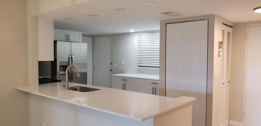 Fabulous condo in Boca. This is what you have been waiting for. Bright kitchen with new white cabinetry, light quartz counters, brand new kitchen appliances, built in breakfast bar with additional storage, open floor plan with neutral tile, freshly painted throughout, large master w/ walk in closet, new master bath w/ dual sinks  large walk in shower w/ pebble floor, 2nd bath is also updated, 2nd bedroom has two closets, 3nd bedroom has French doors and closet, step out on the patio with lovely view, This is all age condo and close to schools, shopping  entertainment ,I95 , beaches and more. This will not last at this price !