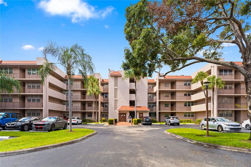 LOWEST PRICED THREE BEDROOM UNIT!! TOP SCHOOL DISTRICT! Spacious & bright 3-bedroom, 3rd floor unit desirable triple-split floor plan. This well-maintained condo features tile and laminate flooring throughout, in-unit washer/dryer. Enjoy lake and golf course views from your private balcony. Unit includes 1 deeded parking space and ample guest parking. Private storage space. Residents enjoy access to 3 pools, exclusive private country club, which offers a golf course, tennis, pickleball, basketball courts & restaurants with access to Country Club as Owner!  This community sits within the Pine Islands Ridge Country Club and is nestled behind some major shopping and highways, just far enough you won't notice, but close enough to make it easy to commute to local schools, shopping malls, etc.