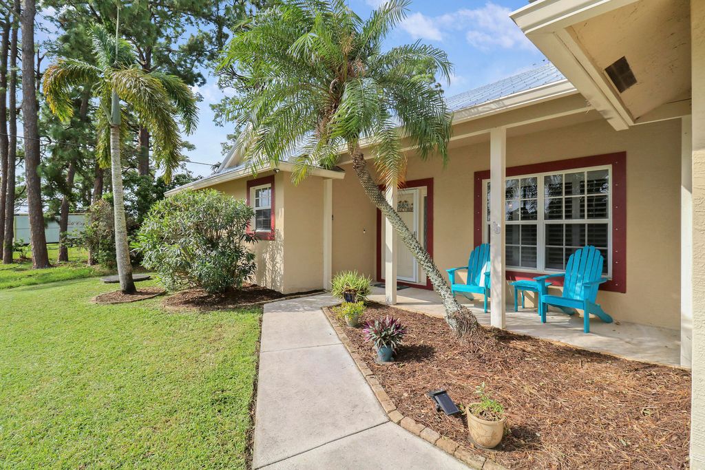 Photo of 105 SE Crosspoint Drive, Port Saint Lucie, FL 34983 (MLS # R11029879)