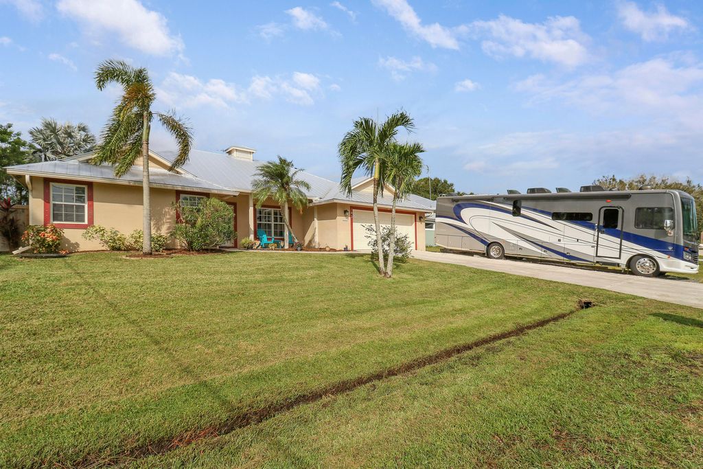 Photo of 105 SE Crosspoint Drive, Port Saint Lucie, FL 34983 (MLS # R11029879)