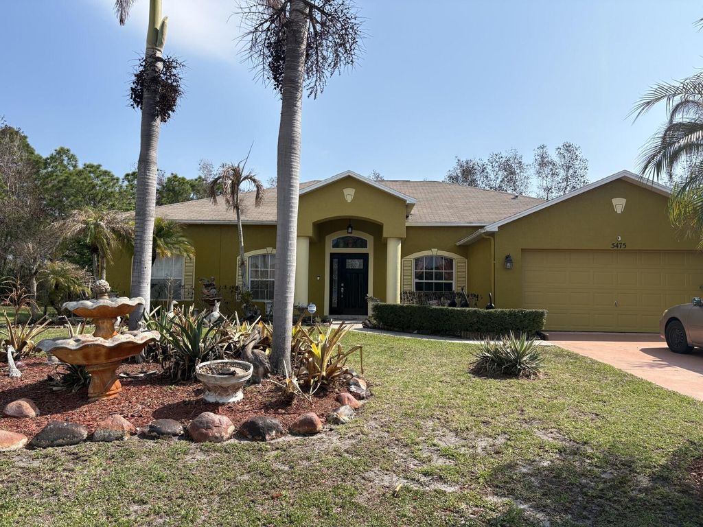 Photo of 5475 NW North Crisona Circle, Port Saint Lucie, FL 34986 (MLS # B26010725)
