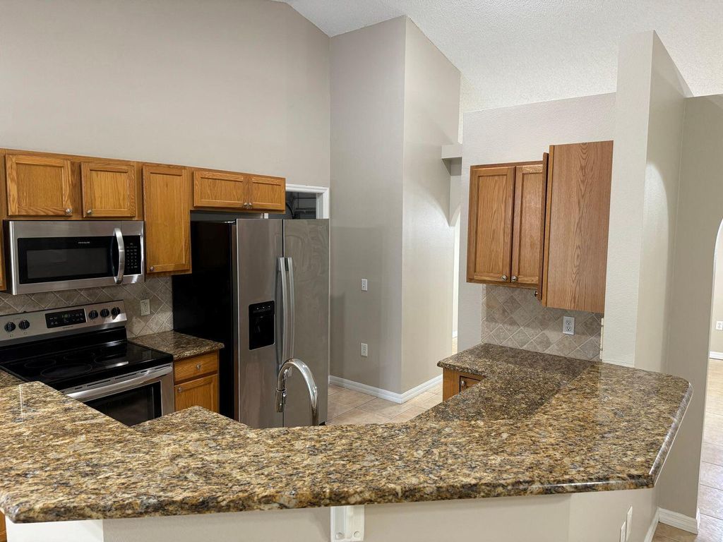 Photo of 5251 NW Gamma Street, Port Saint Lucie, FL 34986 (MLS # R11046095)