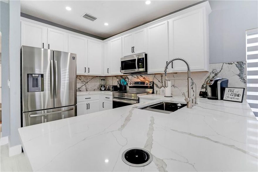 2022 Renovated Smart Home with premium Calacatta Marble counter tops in both baths and the massive, bright kitchen, filled with stainless steel appliances. Whole house soft water system, tankless water heater, soaking tub, rainfall shower, multicolor/cycling LED cloud light system combine for a luxury spa feel. Smart entry doors are compatible with Amazon Key for secure package delivery. Stunning 24x48 tile throughout, reflecting smart LED recessed lights. Smart smoke/carbon monoxide detectors and thermostat monitor and report constantly. All situated on one of the largest lots in this highly desirable, rarely available, neighborhood. Broker has ownership interest in this 100% move in ready gem, built 2005. Come by, then compare its value and HOA to local new construction. This is the one!