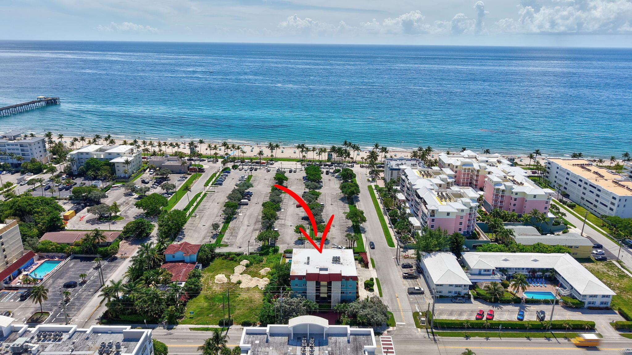 Wake up to the blue ocean in this bright corner condo at 180 SE 20th Ave #201. This 2-bedroom, 2-bath home has 1,033 sq ft of space with big sunny windows and fresh paint inside. Enjoy direct ocean views from your private balcony that will never be blocked. Stay cool with a new A/C. Relax in the sparkling pool or walk to the sandy beach and Deerfield Beach Pier just steps away. No special assessments, and the $835 monthly HOA covers many comforts. You get garage parking plus guest spots. Rent right away, once a year for at least three months. Move in and start your beach life today!