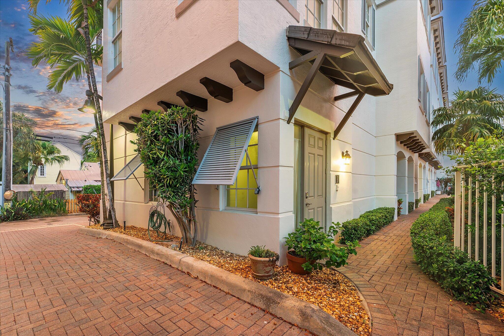Enjoy the ultimate Delray Beach lifestyle in this beautifully maintained end-unit townhouse, ideally located minutes from Atlantic Avenue's vibrant dining, boutiques, and the beach. As a coveted corner residence, the home is filled with natural light from an abundance of windows and offers rare features not found in other units--including three private balconies, one conveniently located off the kitchen for grilling, and the only second-floor balcony in the community. Overlooking the resort-style pool with its tranquil waterfall, this home blends elegance with ease. The first floor features rich cherry wood flooring, a spacious laundry room, and an oversized garage.
