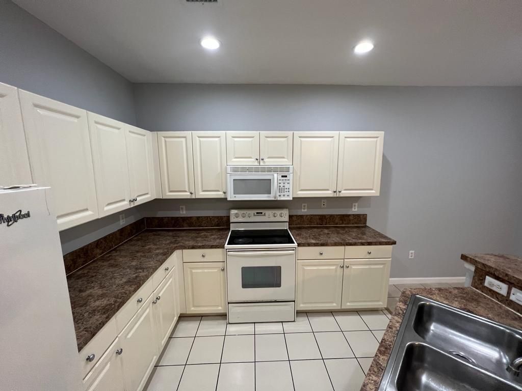 Photo of 2018 Freeport Lane, Riviera Beach, FL 33404 (MLS # F10524186)