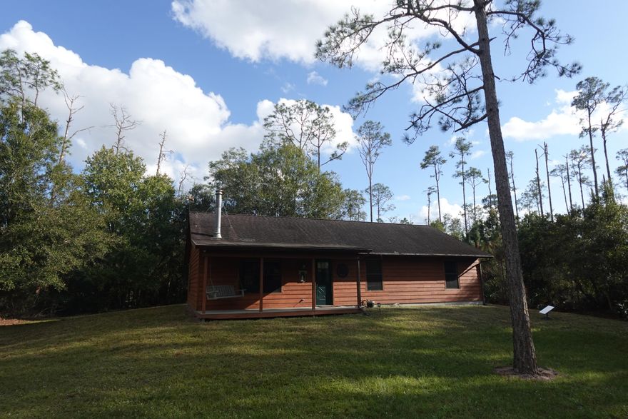 Charming 3-bedroom, 2-bath fully furnished cabin in the gated Indian Hammock community on 4.72 private acres with a serene pond, island, and dock. Features Mexican tile, cozy fireplace, cabin-style interior, brand-new kitchen appliances, washer/dryer, and turnkey dishes, pots, and silverware. Surrounded by nature for privacy and tranquility. Preferred lease 6-12 months; alternative terms may be considered with adjusted rates. Pet restrictions apply. Appointment required to enter—please schedule prior to arrival!