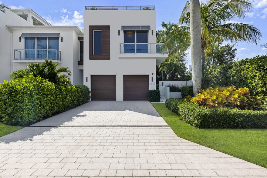 Introducing a masterpiece of coastal living, quality constructed 3 bedroom, 3.1-bathroom plus office luxury townhouse built by Azure in 2018 nestled in one of the most coveted locations, just two blocks away from the pristine beach and a stone's throw from the vibrant Atlantic Avenue. 
This exceptional residence designed and decorated by renowned Leighton Design Group offers a lifestyle of unparalleled sophistication and comfort.
Upon arrival, you'll be immediately captivated by the exterior, featuring a harmonious blend of modern architecture and coastal aesthetics.
As you step inside, you'll be greeted by a two level foyer that seamlessly flows into the open concept living spaces. The interior design is a testament to refined taste, with every detail carefully curated to... create an atmosphere of opulence and relaxation. 
The gourmet kitchen is a chef's dream, equipped with top-of-the-line wolf appliances including gas cooktop, built -in Subzero refrigerator and freezer, wine chiller, custom cabinetry, and a spacious island with quartz countertops. It's a perfect space for culinary creativity, and it seamlessly connects to the dining area, making it ideal for entertaining friends and family.
The living room is a sanctuary of comfort, boasting floor to ceilings windows that flood the space with natural light and provide breathtaking views of the lush surroundings and stunning blue salt water pool. 
The townhouse features an extra deep lot with multiple outdoor spaces, including a private rooftop terrace with panoramic views of the beach and intracoastal area. 
This serene oasis is perfect for sunset cocktails or morning yoga sessions. On the ground floor, a beautifully landscaped yard offers a secluded retreat for relaxation and the summer kitchen allows for the perfect setting to dine outdoors with a covered lanai and electronic screens. 
The spacious bedrooms are designed as tranquil sanctuaries, each with its own in-suite bathroom and ample closet space. The main suite is an epitome of luxury, featuring a spa-inspired bathroom with a wet room soaking tub and double rainfall showers.
Smart home technology has been seamlessly integrated throughout the property, allowing you to control lighting, climate, and security with ease.
This townhouse represents the pinnacle of coastal living, offering a lifestyle where you can effortlessly blend the beauty of the beach with the convenience of downtown living. Whether you're strolling along the shoreline, exploring the charming shops and restaurants nearby, or simply enjoying the serenity of your private retreat, this luxury townhouse offers the best of both worlds. It's not just a home; it's an embodiment of coastal elegance and modern sophistication.