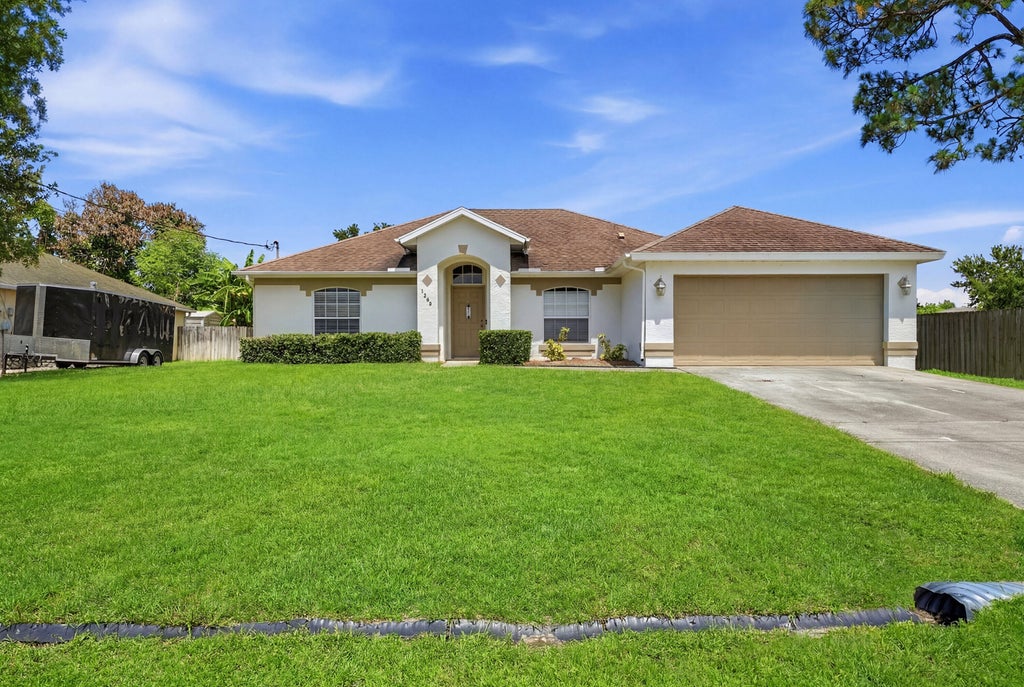 Photo of 1293 SW Kalevala Drive, Port Saint Lucie, FL 34953 (MLS # B26040610)