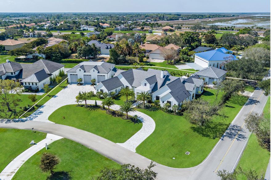 2026 NOW COMPLETED!

In the sought-after neighborhood of Aero Club, an aviation community with its own private runway, this custom-built masterpiece designed by Diaz & Lang and interiors by HW Interiors is almost complete. Located on one of the largest lots in the neighborhood, this home features 5 bedrooms, 7 full & 2 half baths, 2 laundry rooms, and 3-car garage. 8,400+/- SqFt. Under air. Additionally, a 70'x60' 4,400+/-SqFt. hangar & a third structure containing 2,000+/-SqFt. of hangar space. Boasting with high-end finishes are exquisite attention to detail throughout. Featuring high ceilings, designer lighting, and impeccable craftsmanship. The open-concept layout seamlessly connects the living, dining, and kitchen areas, creating the perfect space for entertain ing guests or enjoying quiet family evenings. 

Special features include a dedicated exercise room housed with a full steam room+ sauna, a theater room perfect for movie nights with a wet bar + bath, a gorgeous wine room accompanied by a marble backsplash. The kitchen will feature a fluted pill shaped island with high-end appliances. Important finishes include brass hardware, warm wood tones. All bedrooms feature their own ensuite bathrooms for ultimate comfort and convenience. Lounge by the sparkling heated saltwater pool, dine al fresco on the beautiful covered outdoor living area with a custom built summer kitchen. 

Aero Club is located just minutes away from the Winter Equestrian Festival. Wellington Aero Club is a private aeronautical community located in Wellington, Florida. It features 240 custom-built homes on one-acre lots, many with private hangars, and a lighted and paved 4,000 foot runway. There is also AV Gas available directly at the airport.