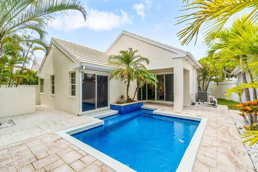 Nestled within the prestigious Barclay Club at PGA National Golf and Country Club, this charming three-bedroom, two-bathroom home delivers the Florida lifestyle you've been dreaming about — complete with a private pool that practically begs for weekend lounging.  Step inside and you'll immediately notice the abundance of natural light flooding every room. The common areas showcase stunning new porcelain wood plank tile flooring that strikes the perfect balance between elegance and easy maintenance. The kitchen features custom cabinetry and a cozy dinette area beside a beautiful bay window — the kind of spot where morning coffee becomes a genuine ritual.  The spacious primary bedroom offers a generous walk-in closet, while the ensuite bathroom impresses with dual sinks and a luxurious  soaker tub designed for unwinding after a round on the greens. The guest bathroom has been fully remodeled and thoughtfully updated.  Sliding glass doors open to a covered lanai and private backyard oasis centered around the sparkling pool — your personal retreat from the everyday hustle. The two-car garage has been smartly outfitted with a workbench and built-in cabinetry for those who appreciate practical storage solutions.  This vibrant Palm Beach Gardens neighborhood places you minutes from PGA National Park and convenient shopping at nearby Mirasol Walk. The active golf community offers dining and entertainment options that keep your social calendar full.