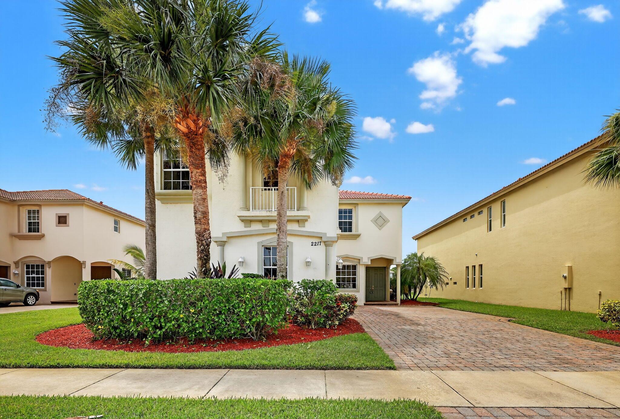Estate-sized 5BR/4BA/3CG home with 3,500+ sq. ft., serene lake views, and a large covered patio, built with solid CBS on both floors. Updates include newer A/C and water heater (2020), new fridge, fresh paint, and no-carpet flooring--tile down, vinyl plank up--plus volume ceilings, 8-ft doors, and irrigation on a private well. Located in the gated Newport Isles community, residents enjoy 3 pools, clubhouse, fitness center, and sports courts for just $198.30/month HOA. Ideally situated near I-95, Florida's Turnpike, and the Tradition area, with beaches, dining, shopping, and parks just minutes away, this move-in-ready home offers size, quality, and lifestyle--just bring your toothbrush!