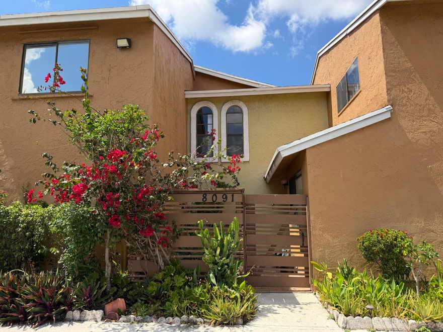 Come discover this charming 3-bedroom, 3-bathroom townhome located in the desirable Pineapple Park at Woodmont community in Tamarac. Centrally situated near hospitals, shopping, schools, and everyday conveniences, this home offers both comfort and accessibility. This well-maintained residence features over 1,500 square feet of living space, with each bedroom designed as its own private suite—perfect for families, guests, or added flexibility. The updated full bathrooms add a modern touch throughout the home.  Enjoy relaxing on the screened lanai overlooking a peaceful lake view, while the backyard boasts mature fruit trees, creating a serene outdoor retreat.