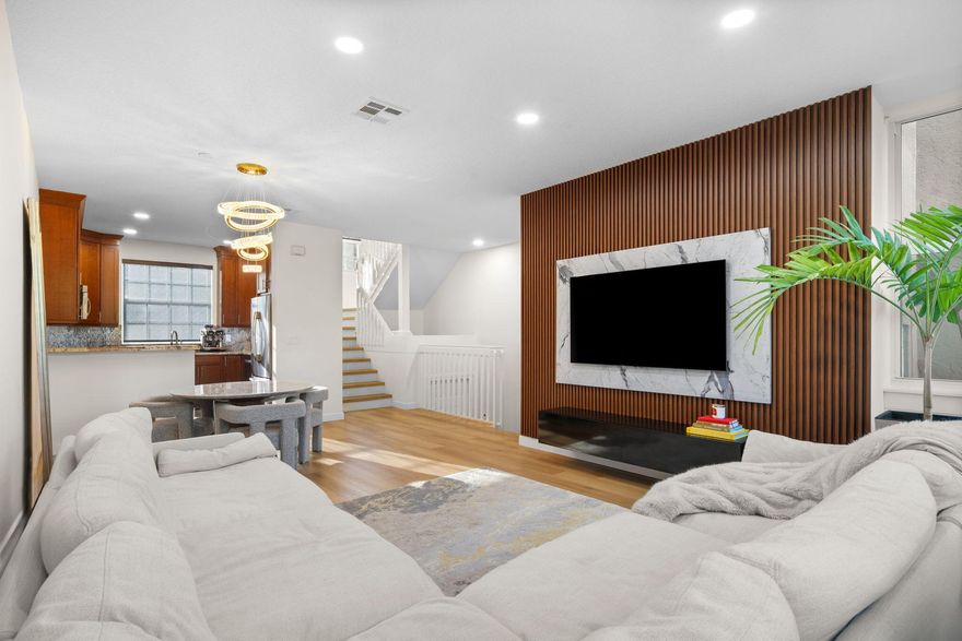 Renovated 3BR/3BA townhome in Fort Lauderdale's historic Sailboat Bend, offering a bright open layout, warm wood flooring, designer lighting, updated baths, and a sleek feature wall in the living room. Kitchen features wood cabinetry, granite counters, stainless steel appliances, and great storage. Spacious primary suite with a beautifully remodeled bath. Enjoy a lush tropical pool setting just outside your door in this well-kept community. Ideally located near Downtown Fort Lauderdale, Las Olas dining and shopping, Riverwalk, and the beaches.