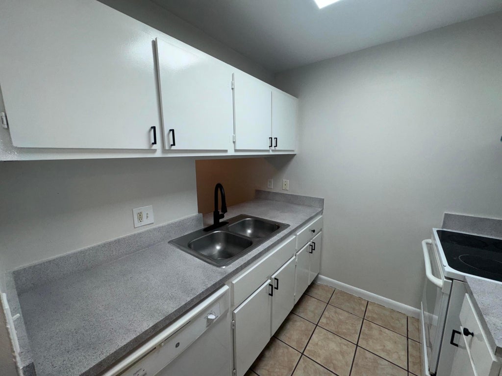 Photo of 1790 Abbey Road #102, West Palm Beach, FL 33415 (MLS # B26027882)
