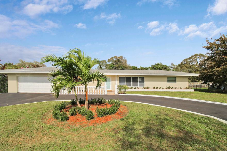 Fully renovated, modern single-family home in the sought-after Mango Gardens. This stunning property boasts a spacious, open living room bathed in natural light, complemented by sleek, fully-tiles flooring throughout. The kitchen is a chef's dream with modern finishes. It features two beautifully renovated bathrooms and a master bedroom iwth a large walk-in closet. Enjoy the outdoors in comfort with a screened patio and a large backyard. Ideal for those seeking a blend of luxury and convenience in a prime location.