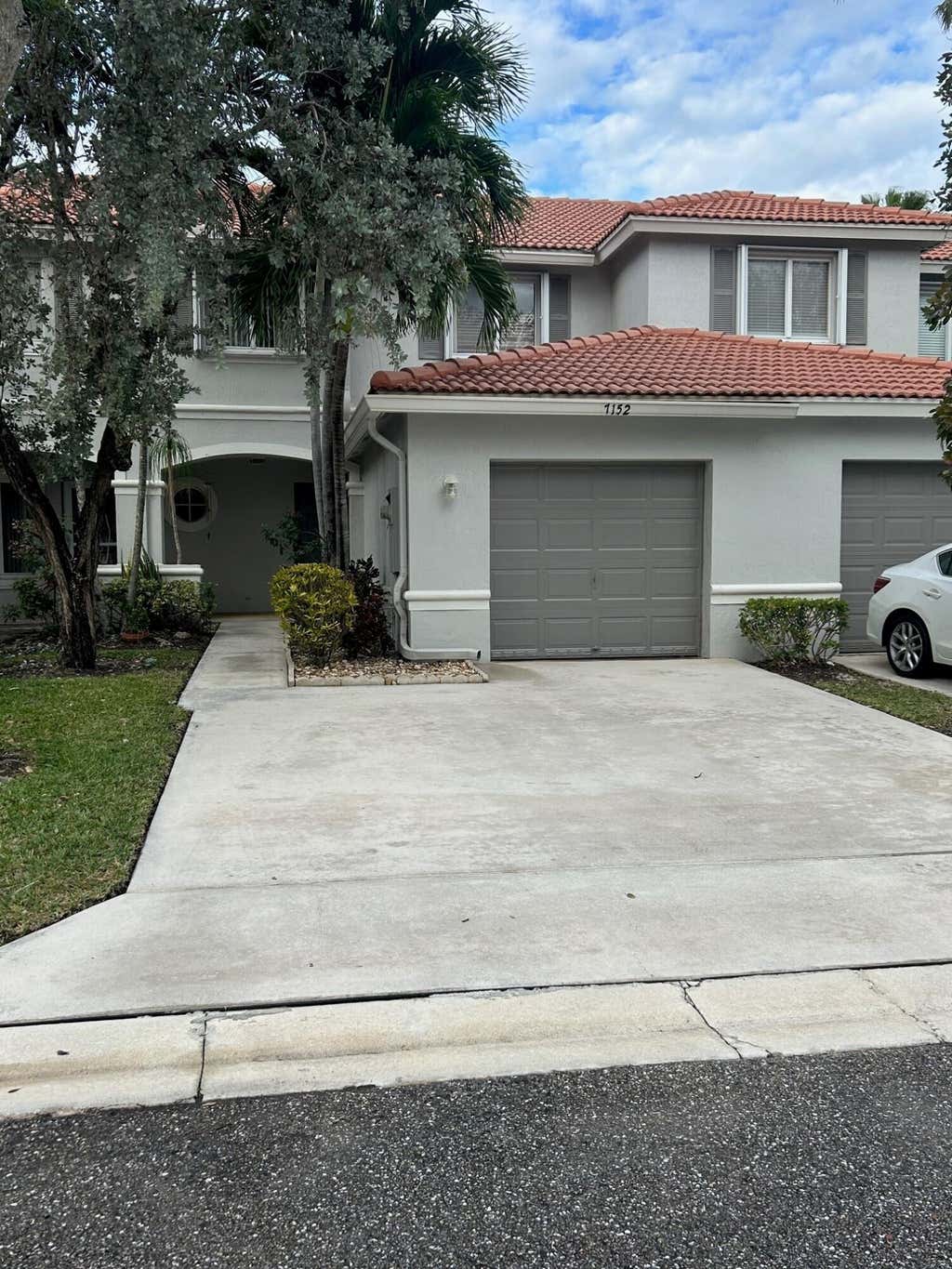 Photo of 7152 Hawks Nest Terrace, Riviera Beach, FL 33407 (MLS # R11024757)