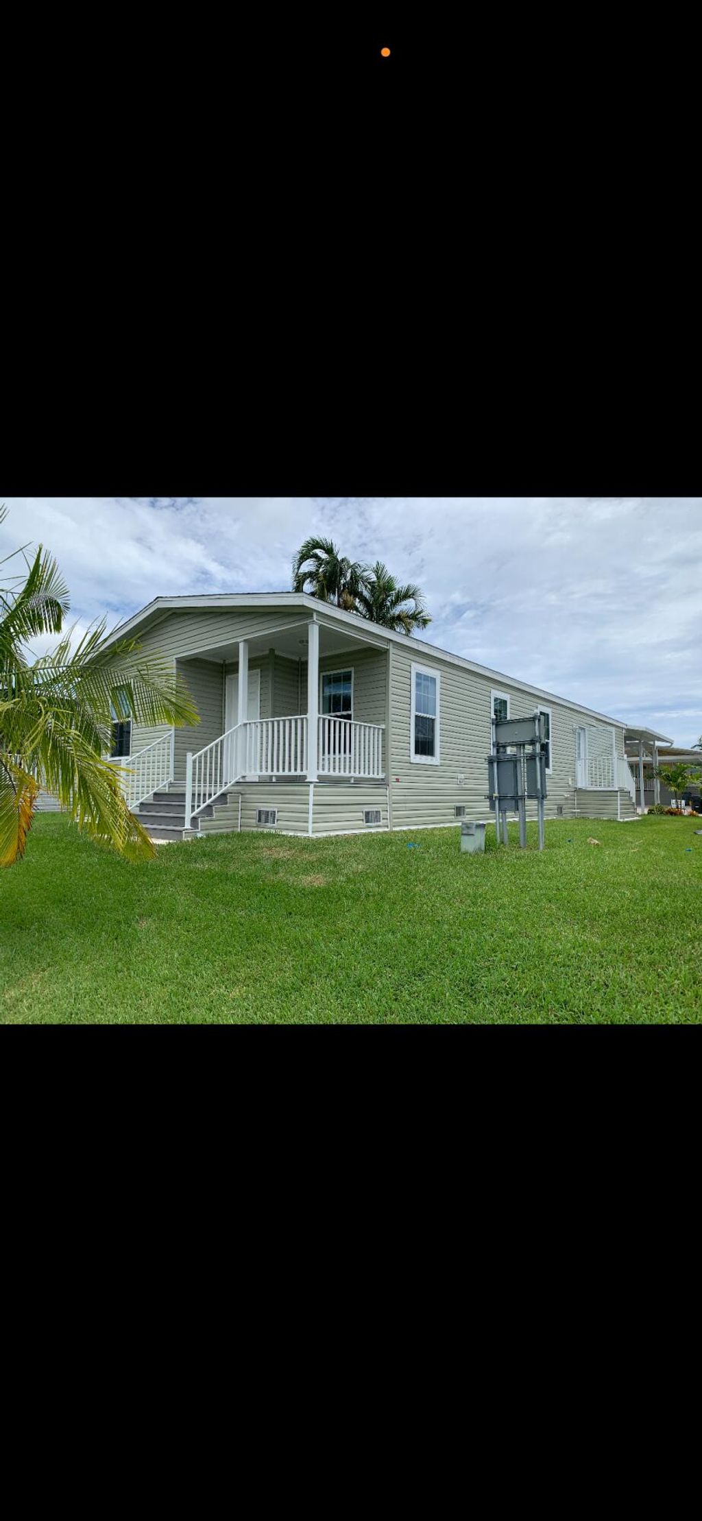 Photo of 164 Plantation Boulevard, Lake Worth, FL 33467 (MLS # B26023052)