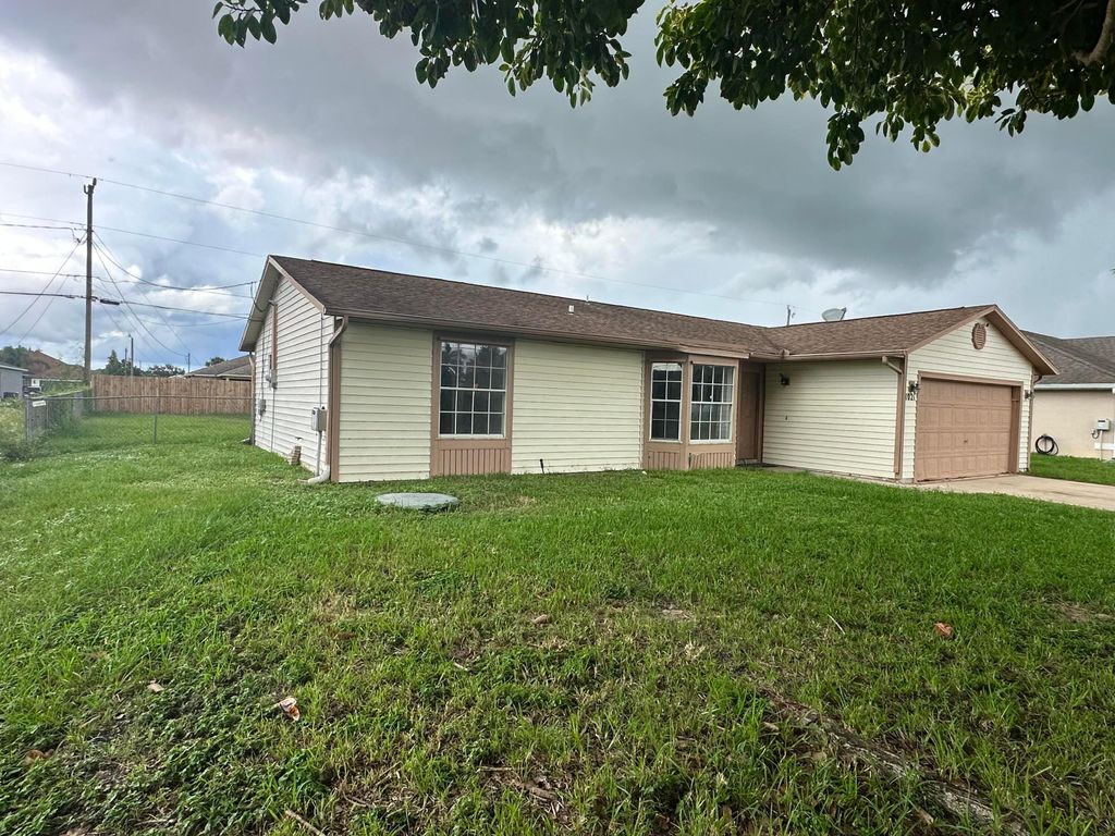 Photo of 1021 SW Dubois Avenue, Port Saint Lucie, FL 34953 (MLS # B26021413)