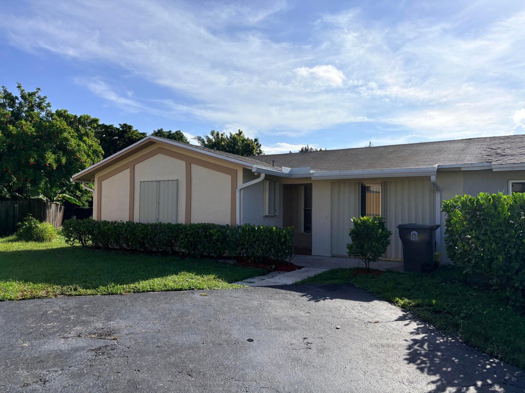 Photo of 8732 Satalite Terrace, Lake Park, FL 33403 (MLS # B26072214)