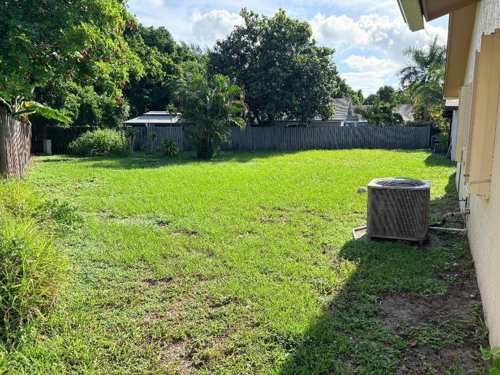 Photo of 8732 Satalite Terrace, Lake Park, FL 33403 (MLS # B26072214)