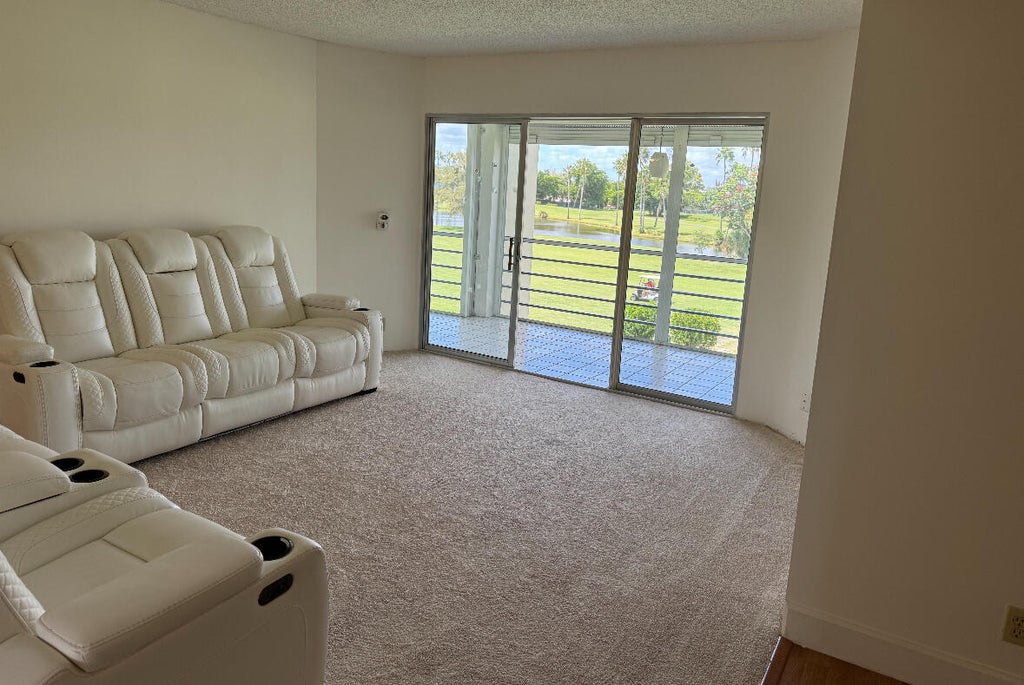 Photo of 3871 Via Poinciana #302, Lake Worth, FL 33467 (MLS # R11070506)