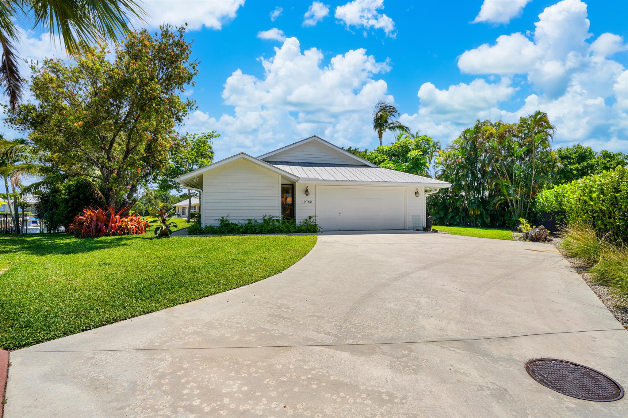 Experience the best in waterfront living at The Harbour at Hobe Sound--a quiet, well-established coastal neighborhood ideal for those who cherish serene water views and the boating lifestyle. This impeccably maintained 3-bedroom, 2-bathroom home is perfectly positioned on a wide canal, offering stunning waterfront vistas and direct ocean access with no fixed bridges. A private dock accommodates vessels up to 35 feet, making this a true boater's paradise.