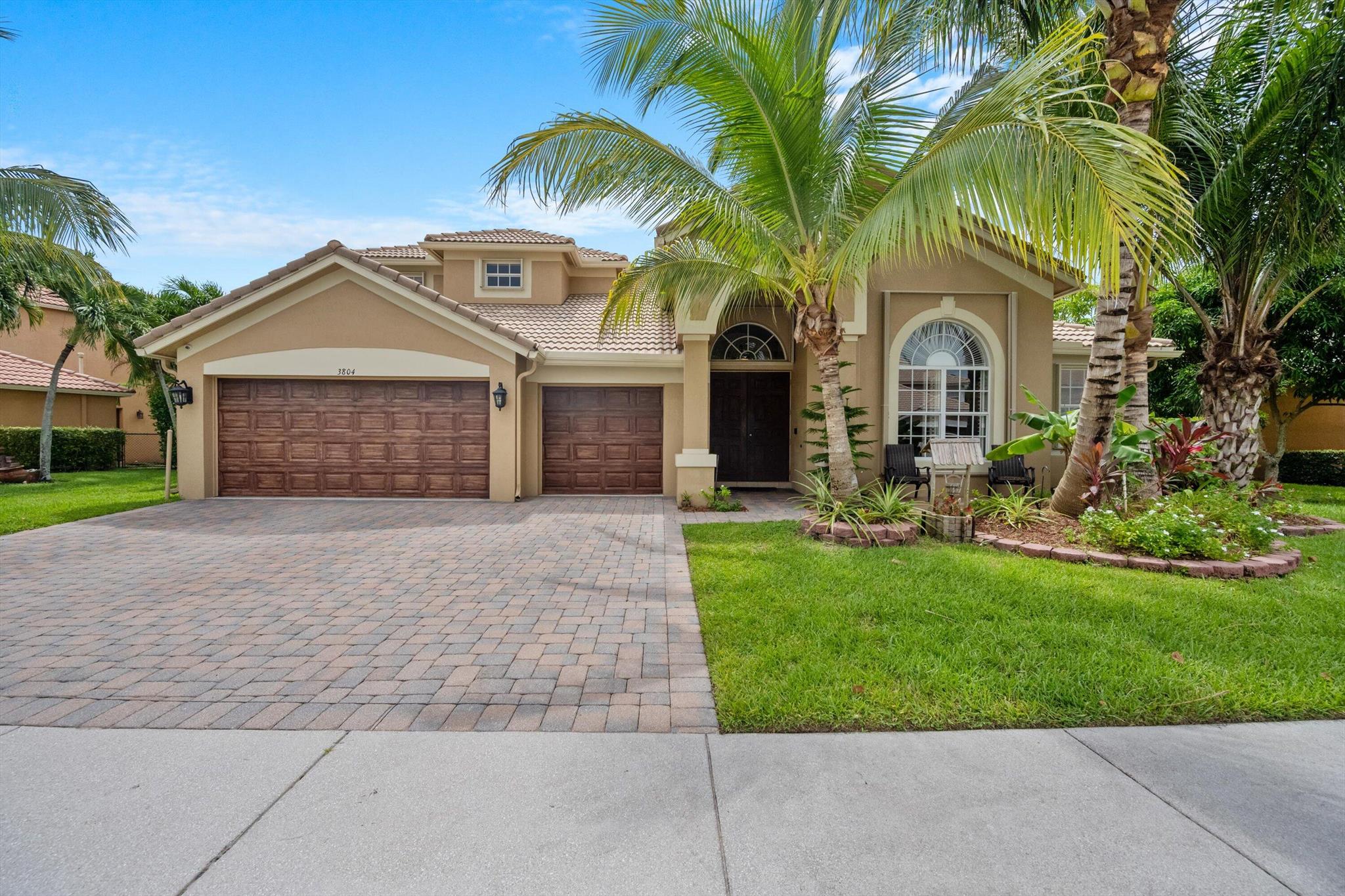 This stunning 5 bedroom, 4 bathroom home is located in a desirable gated community and offers both elegance and functionality. Step inside to soaring tray ceilings, architectural arches, and an abundance of natural light that creates a warm and inviting atmosphere. The spacious living areas flow seamlessly, perfect for entertaining family and friends. The gourmet kitchen features granite countertops, wood cabinetry, a center island, and brand-new stainless steel appliances. Tile flooring runs throughout the main living spaces, combining easy maintenance with timeless style. Complete with accordion shutters for peace of mind, this thoughtfully designed home in a prime location is the perfect blend of comfort and sophistication.