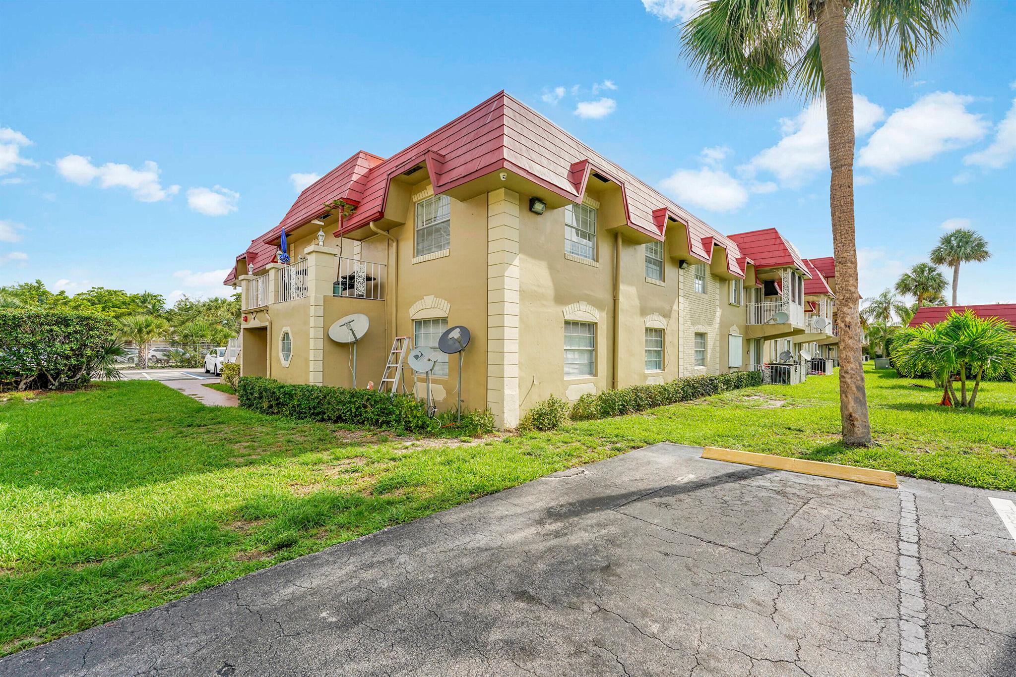 Investor Friendly Condo in Prime Location!** Discover this spacious 2-bedroom, 2-bath gem with a desirable split bedroom plan, perfect for roommates or guests. In unit Washer & Dryer. Located just west of Federal Hwy, this property offers unparalleled convenience with proximity to FAU and easy access to I-95. Ideal for investors looking for a high demand rental area.New Roof replacement and assessment has been paid in full by seller.