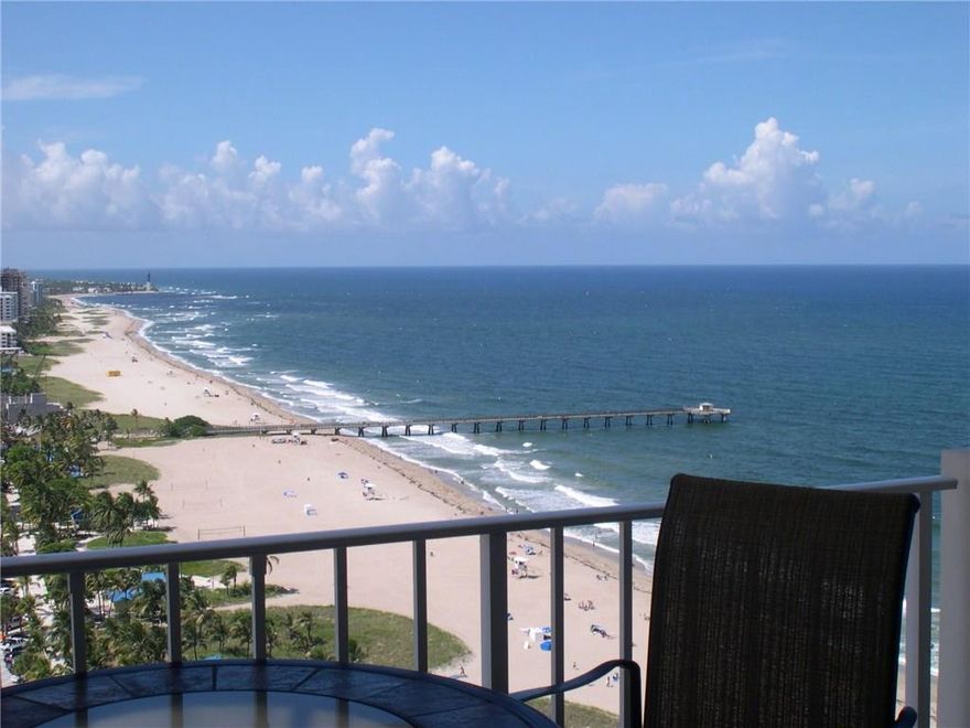 THIS IS THE BOMB! NE CORNER WITH THAT MILLION DOLLAR VIEW YOU HAVE BEEN LONGING FOR! There are Two Balconies! The current owner has done all the work for you! Designer Finishes Include; Kitchen and Baths upgraded with Wood Cabinets, Granite Counters, SS Appliances. Tiled throughout, New AC & Water Heater. New Hurricane Windows and Sliding Doors along with extra protection of New Hurricane Shutters. Furniture Negotiable! Magnificent complex to live & play with the same amenities of a 5 star resort.