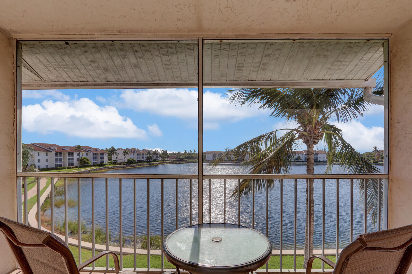 Winter Paradise awaits you **DIRECTLY ACROSS THE STREET FROM THE OCEAN** is this GATED, fully furnished, updated, clean, turnkey, third floor 2/2 condo (no elevator) with screened in private lanai. Amenities include a stocked 7 acre fresh water lake for fishing, two hard surface tennis courts, bocce, shuffleboard, heated pool, spa and community clubhouse. In the heart of the Island this location offers fabulous restaurants, shopping, and beautiful beaches. Cable & wifi inc. June-Dec tenant pays electric. 11.5% tourist tax, 1 mo security dep.,clean fee $125, HOA app fee $100.w/ Background check Monies due up front.. No pets, No smoking!
