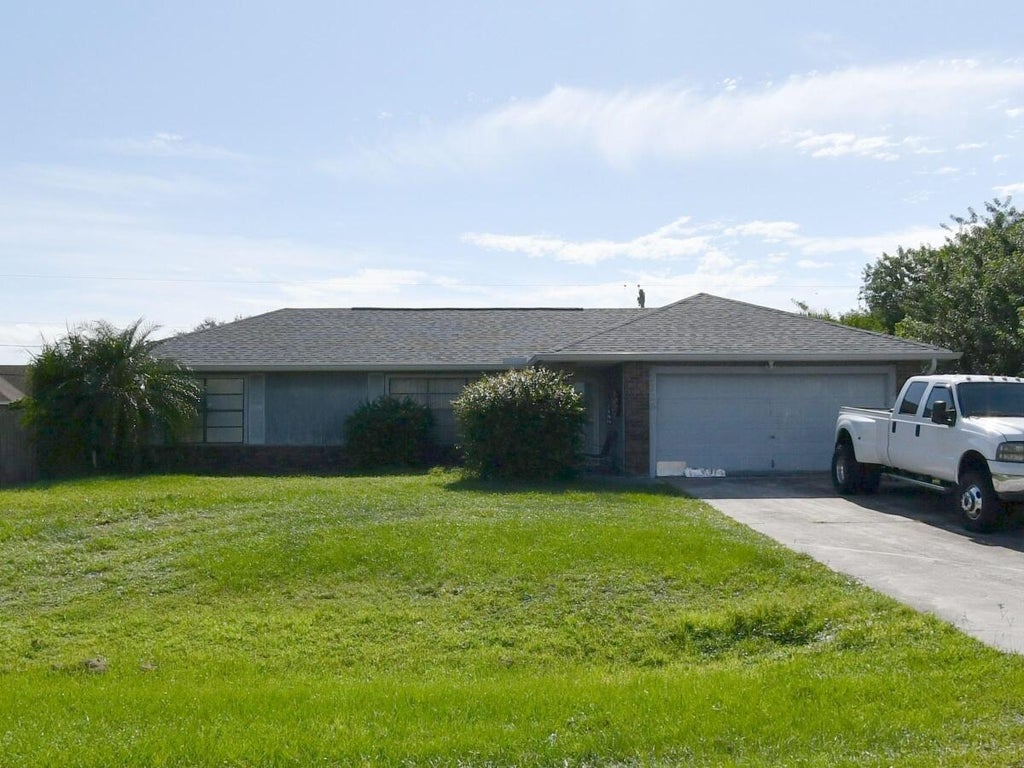 Photo of 1126 SW Del Rio Boulevard, Port Saint Lucie, FL 34953 (MLS # B26043320)