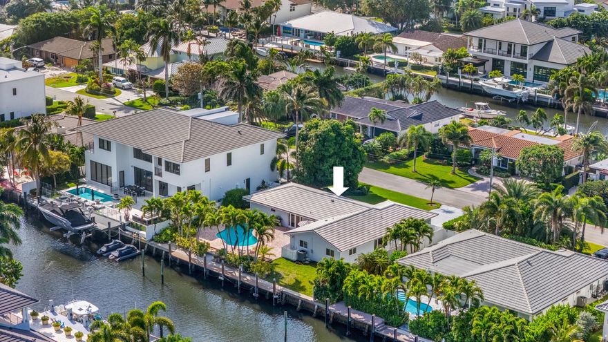 Discover prime waterfront real estate in Delray Beach at this deepwater property in the highly desirable Tropic Isle boating community! This rare offering delivers 90 ft of deepwater frontage, no fixed bridges and direct ocean access via the Boca Raton or Boynton Beach inlets--an exceptional asset for serious boaters seeking a premier South Florida waterfront lifestyle. Positioned for both developers and end-users, this 3BR, 2BA pool home offers strong value with significant upside potential. Open floor plan includes spacious living areas, split-bedroom layout for privacy and bright open kitchen with stainless appliances and granite countertops. Primary suite features dual sinks, granite vanity, frameless glass shower and generous closet space. Second bath functions as cabana bath with