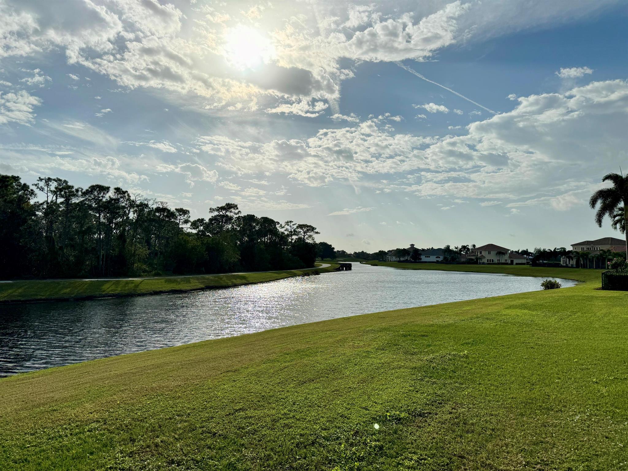 This exceptional keystone-shaped building site offers breathtaking sunrise views of a freshwater creek, a serene forest with a great heron nesting site, and the picturesque 18th tees. With 103 feet of waterfront, the Lakefront site is the perfect location for your next home. Membership in the club is not required, & you may select from one of Tesoro-approved builders. Tesoro's updated design guidelines allow for various modern exterior motifs, allowing you to create your dream home in styles such as Transitional, Coastal Modern, West Indies, & Tuscan. Tesoro is a secure gated community with staffed entry. So please call to view the site or for more information on Tesoro-approved builders, plans, and construction details.