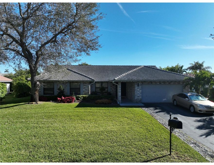 This 3/ 2 Gem has All rooms on the first floor It is Beautifully updated with screened pool Its fenced with nice green shrubs for privacy The backyard is an Oasis with a covered Gazebo lots of space for hosting parties on this oversized Lot. This house has lots of natural light floor to ceiling Impact windows. Entering the Foyer are Smoked Accented Glass Oversized Double Impact Doors with beautiful design. A Gourmet kitchen with custom shaker style cabinets gleaming granite countertops Kitchen with Double Stainless Steel Sink Moen touch-sensor faucet 23 cabinets and a huge pantry with Stainless Steel appliances. There's an Island which defines the space between the Kitchen & the Secondary Living Area Off the kitchen is A formal Dining Area and Formal Living room The Floors are nicely tiled
