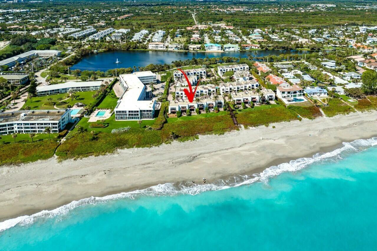 Welcome to 170 Celestial Way 4-4, an exquisite annual furnished oceanfront townhome in the highly sought-after gated community of Juno Beach, FL. This beautiful 3-story residence offers the ultimate in coastal living, just steps from the pristine sands of Juno Beach and the serene Pelican Lake. Located in a charming, small-town setting, this turnkey townhome provides a perfect balance of comfort, convenience, and breathtaking ocean views.The spacious first floor features a cozy living room with an executive desk, ideal for a home office, along with a full bathroom. The second floor is perfect for entertaining, with an eat-in kitchen, family room, dining room, and a large patio with stunning ocean vistas. A convenient half bath completes this level.