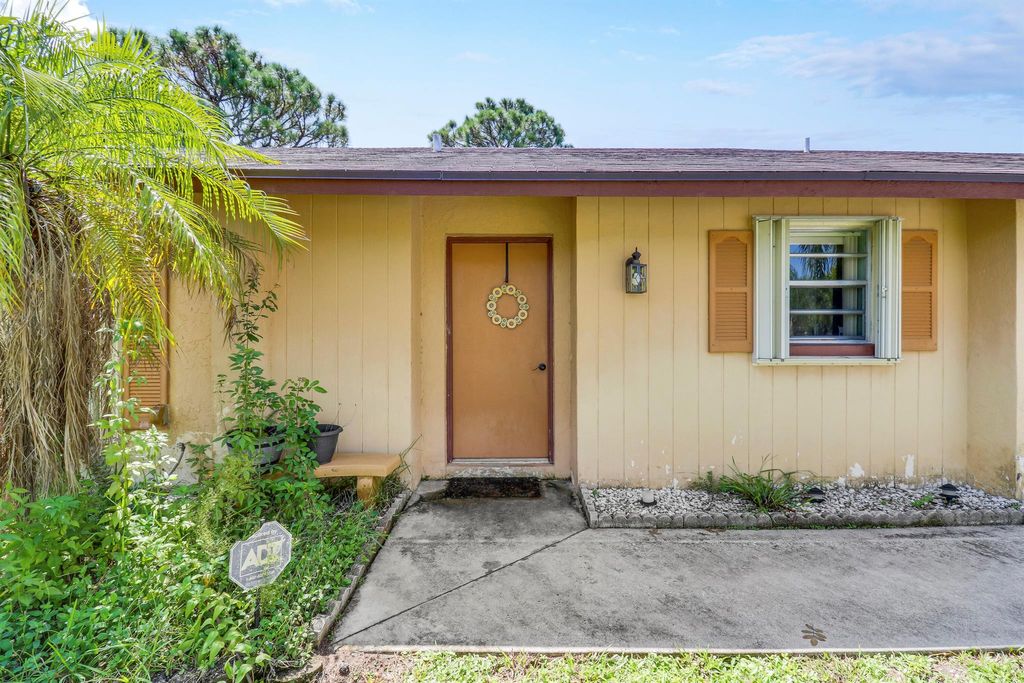 Photo of 244 SW Holden Terrace, Port Saint Lucie, FL 34984 (MLS # R11013623)