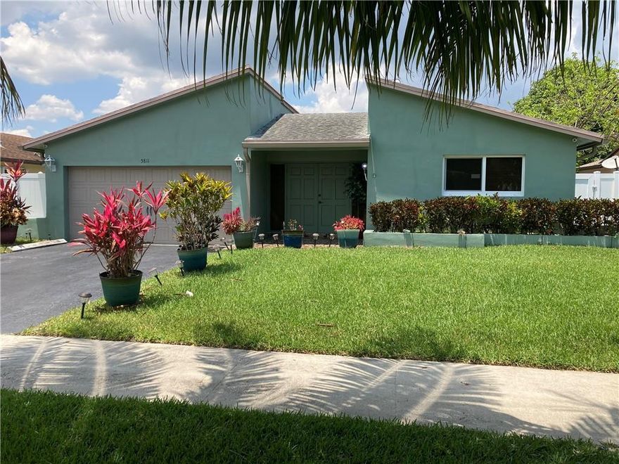 Huge and Beautiful 3 bedrooms 2 baths in Tamarac with High-Impact Windows ,  Solar Panels installed on both sides of the roof, remodeled kitchen with Granite counter, one bathroom nicely remodeled , Water heater less than 2 years old, Popcorns completely removed from ceilings and nicely redone with knock-down, CCTN Security system with 9 cameras , oversized 2 car garage with new opener , Huge screen Patio for your entertainment , Back yard with tropical fruit trees like mangos trees, Coconut trees etc. All will be yours new owner.